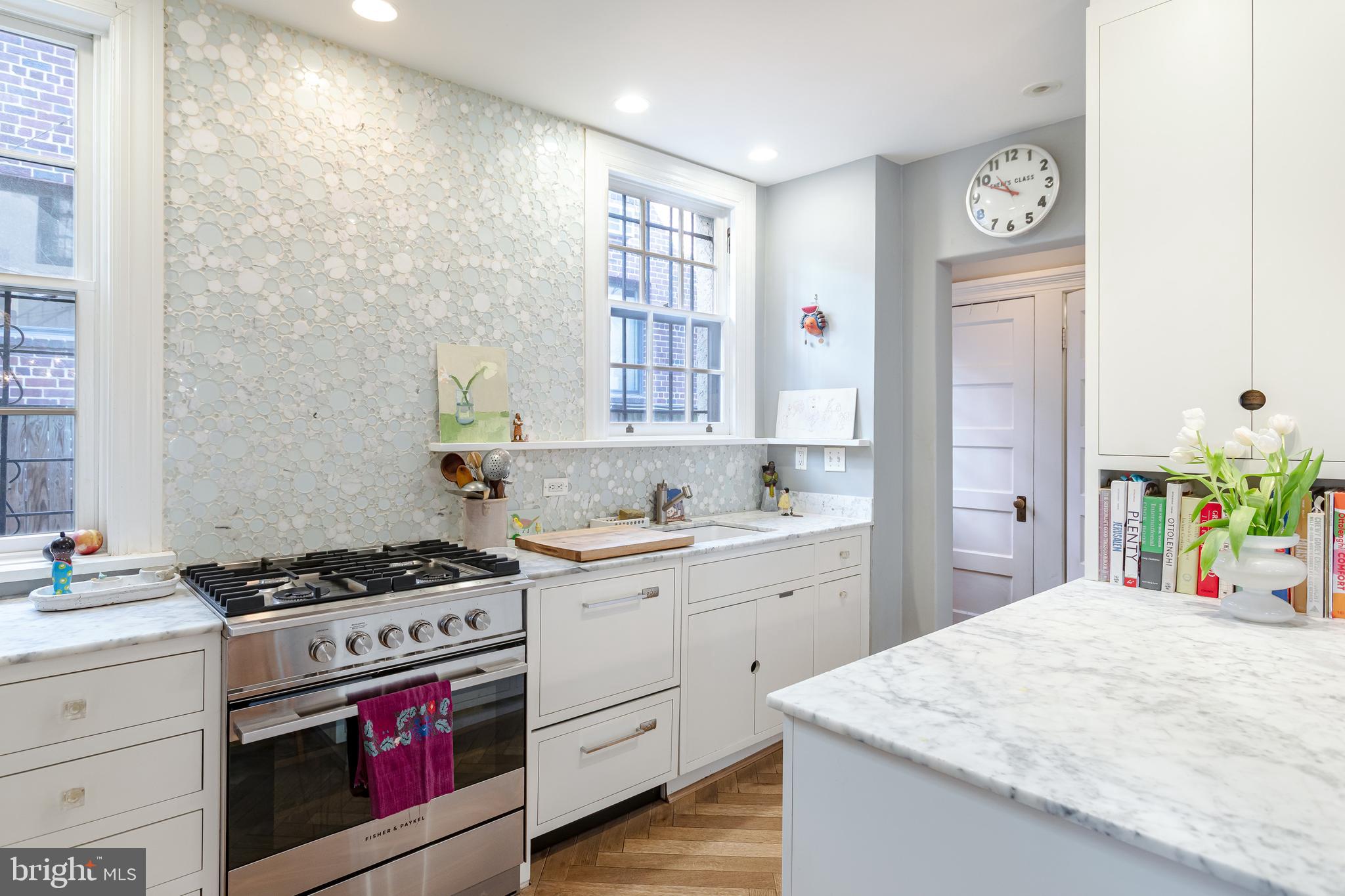 2633 15th Street Northwest, Unit 3 Washington, DC 20009 - Photo 15 of 53 a kitchen with granite countertop a stove a sink and a refrigerator