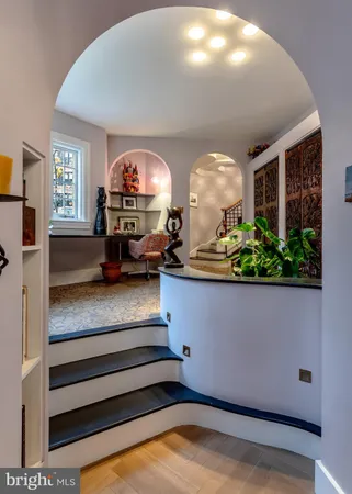 a view of a livingroom with furniture and a staircase