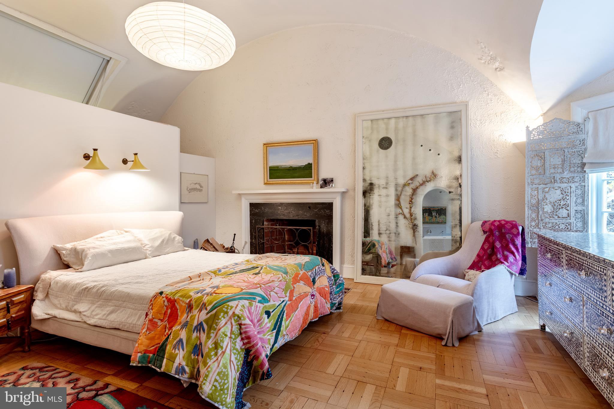2633 15th Street Northwest, Unit 3 Washington, DC 20009 - Photo 23 of 53 a bedroom with a bed and wooden floor