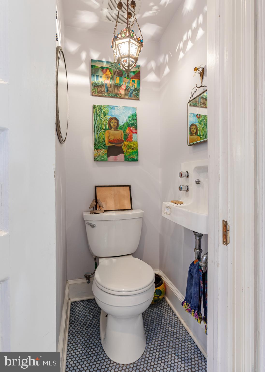 2633 15th Street Northwest, Unit 3 Washington, DC 20009 - Photo 28 of 53 a bathroom with a toilet sink and mirror
