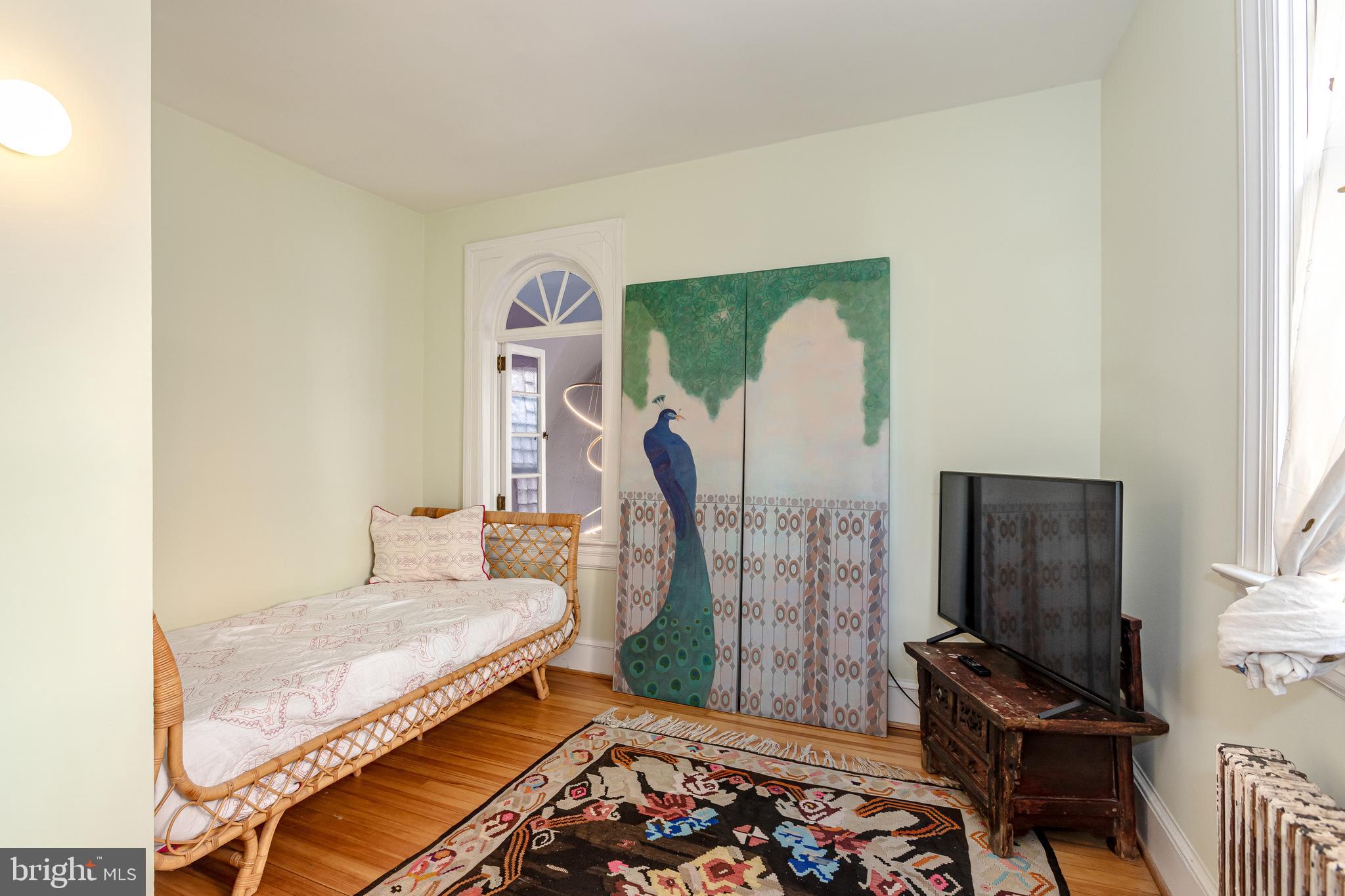 2633 15th Street Northwest, Unit 3 Washington, DC 20009 - Photo 32 of 53 a bedroom with a bed and a window