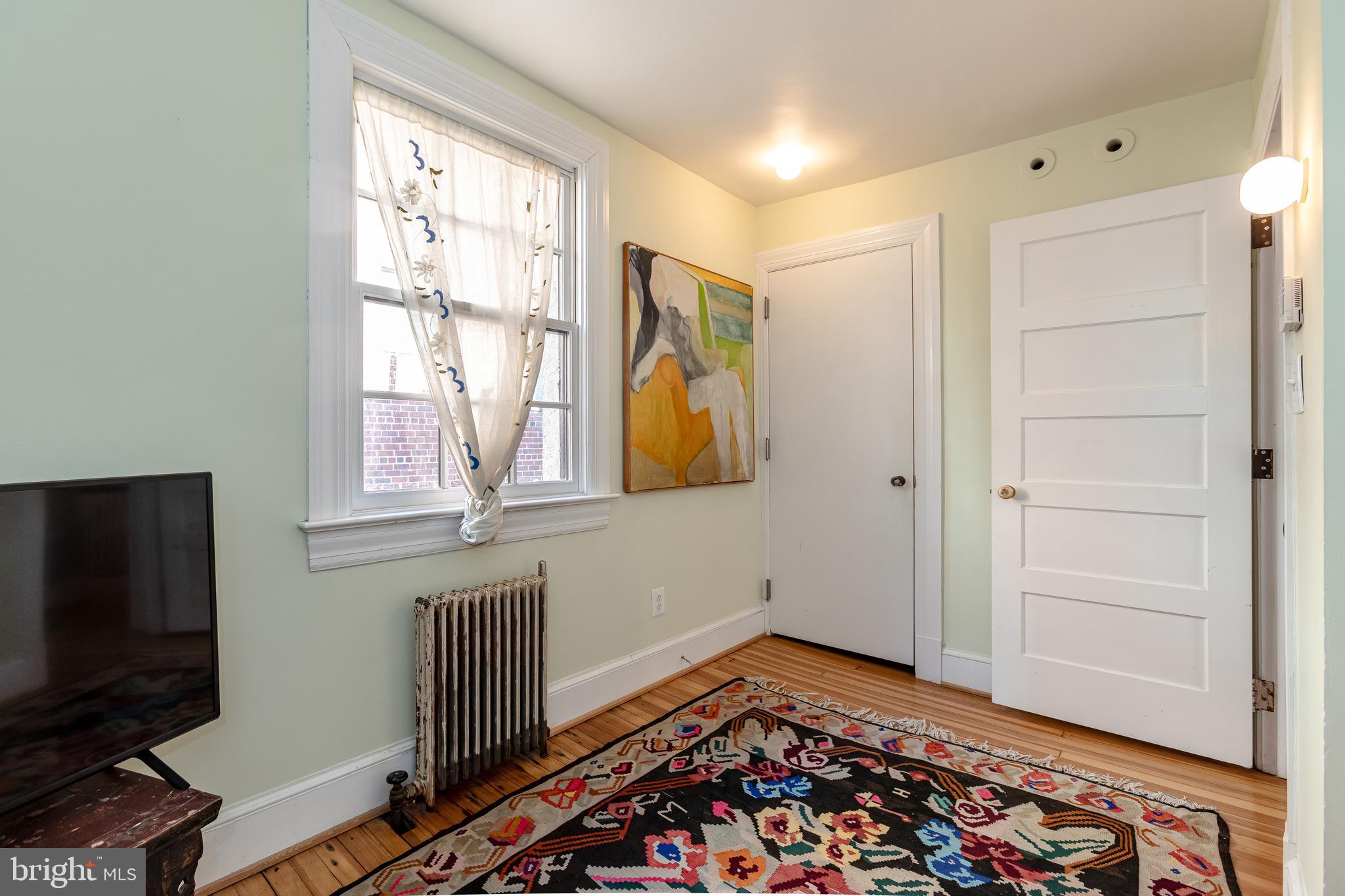 2633 15th Street Northwest, Unit 3 Washington, DC 20009 - Photo 33 of 53 a room with window and flat screen tv