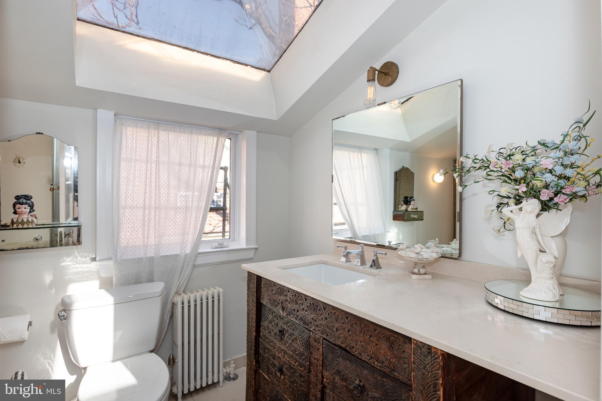 2633 15th Street Northwest, Unit 3 Washington, DC 20009 - Photo 39 of 53 a bathroom with a granite countertop sink and a mirror