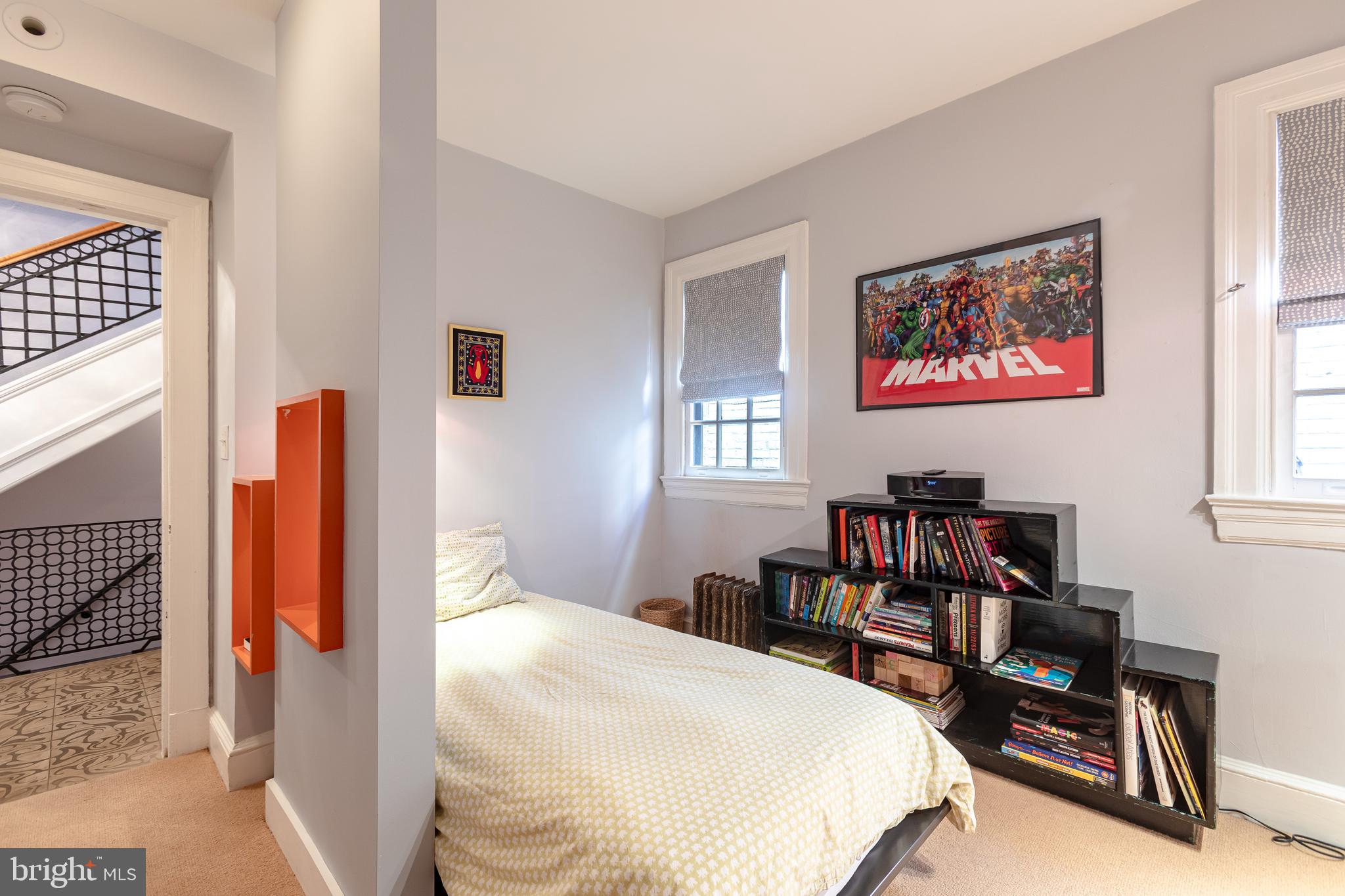 2633 15th Street Northwest, Unit 3 Washington, DC 20009 - Photo 45 of 53 a bedroom with a bed and a table in it