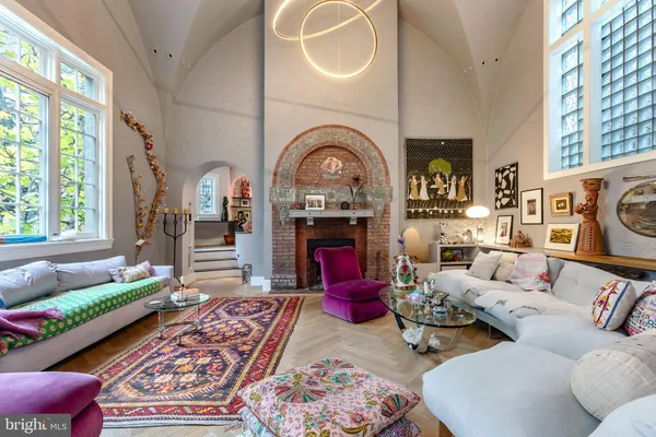 a living room with furniture fireplace and flat screen tv