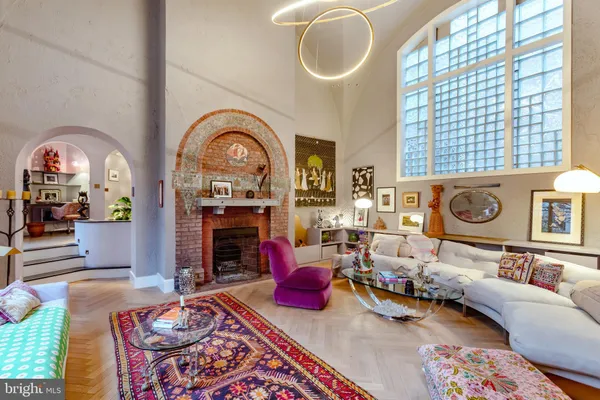a very nice looking dining room with kitchen island furniture and a chandelier
