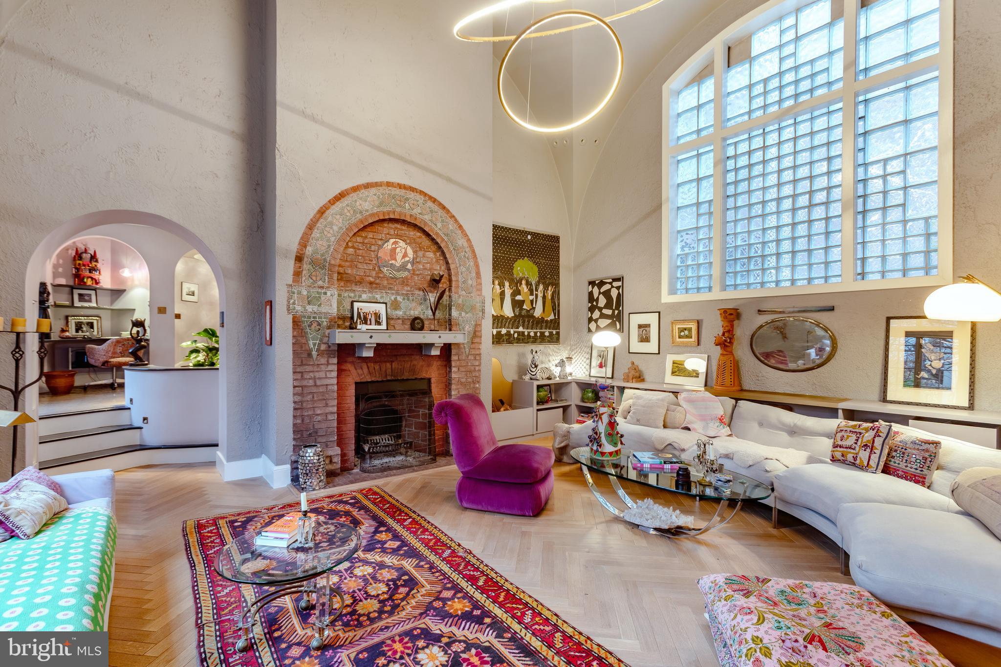 2633 15th Street Northwest, Unit 3 Washington, DC 20009 - Photo 9 of 53 a living room with furniture a fireplace and wooden floor