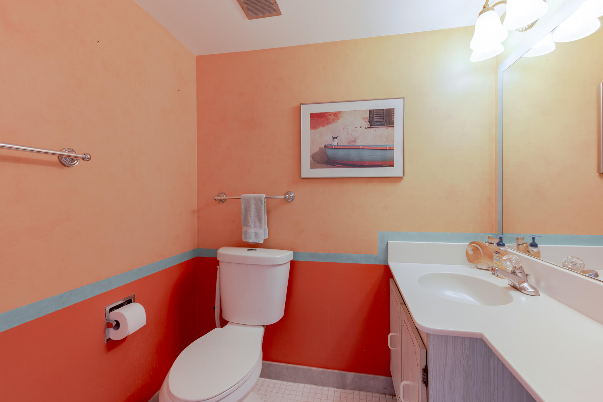 2000 Coco Plum Drive, Unit 301 Marathon, FL 33050 - Photo 21 of 57 a bathroom with a toilet a sink and mirror