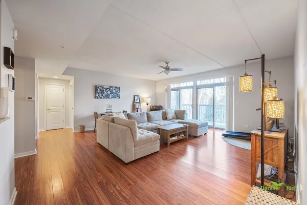 a living room with furniture window and wooden floor