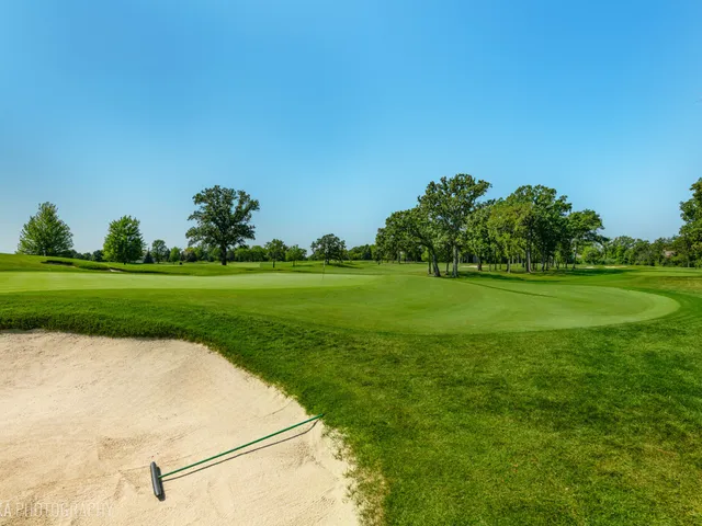 a view of a golf course with a garden