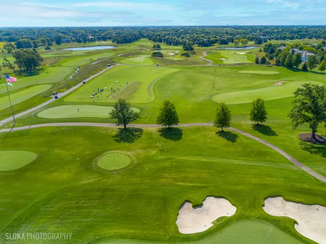 a swimming pool with outdoor seating and yard