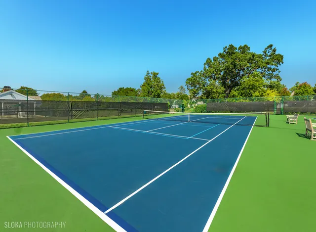 a view of an outdoor space and tennis court