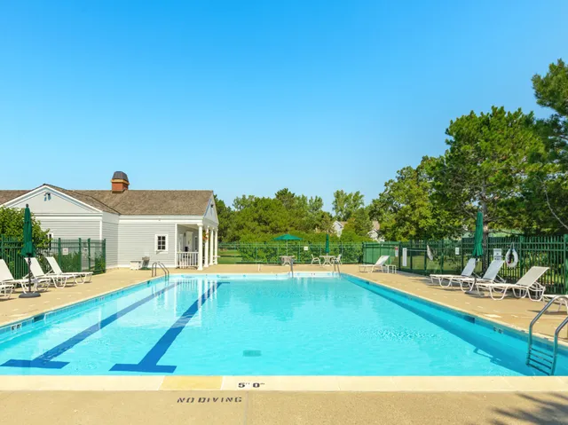 a view of a house with swimming pool