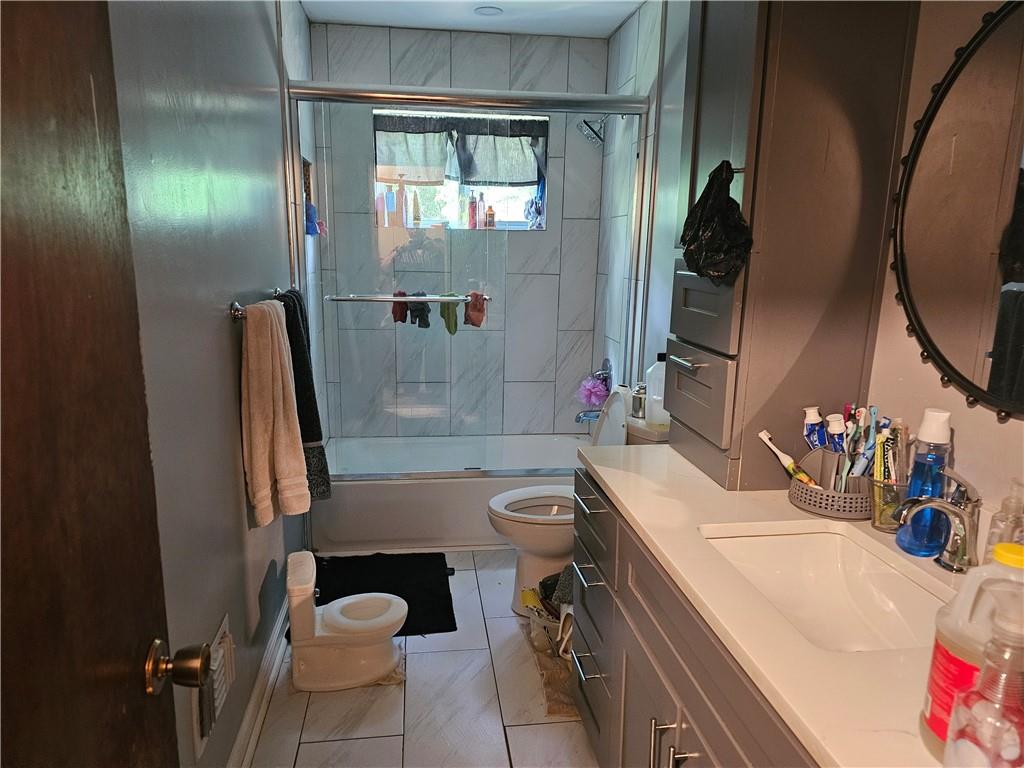 3919 Bressler Circle Decatur, GA 30035 - Photo 2 of 3 a bathroom with a sink toilet and shower