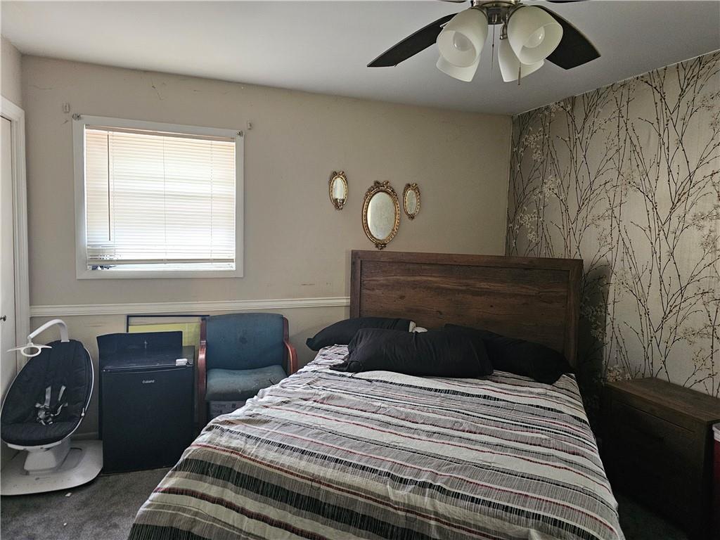 3919 Bressler Circle Decatur, GA 30035 - Photo 3 of 3 a bedroom with a bed and a chandelier