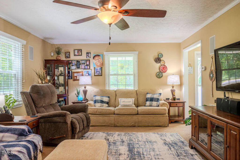 2937 Thrower Road Hope Mills, NC 28348 - Photo 6 of 20 a living room with furniture and a flat screen tv