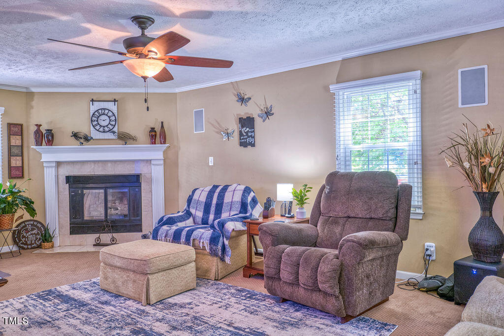 2937 Thrower Road Hope Mills, NC 28348 - Photo 7 of 20 a living room with furniture and a fireplace