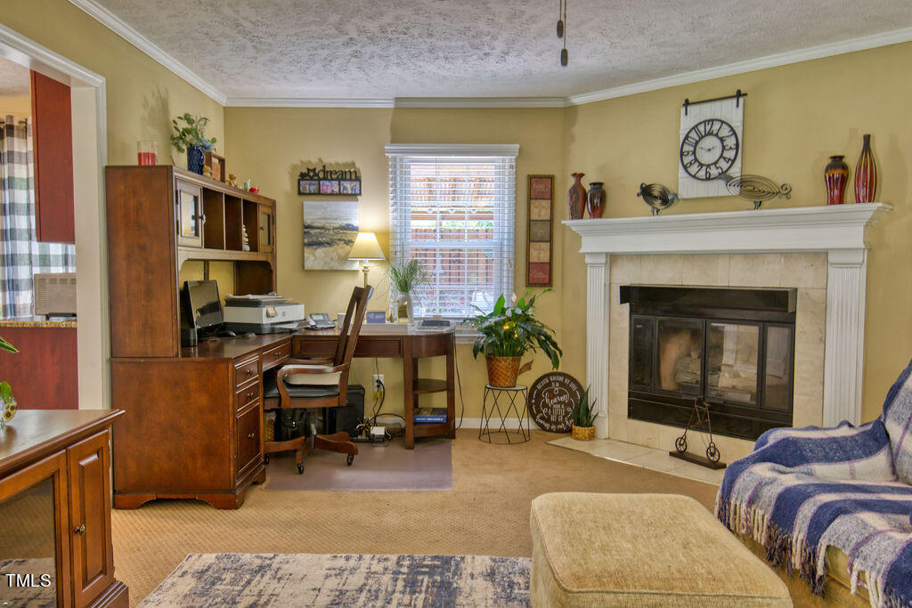 2937 Thrower Road Hope Mills, NC 28348 - Photo 8 of 20 a living room with furniture and a fireplace