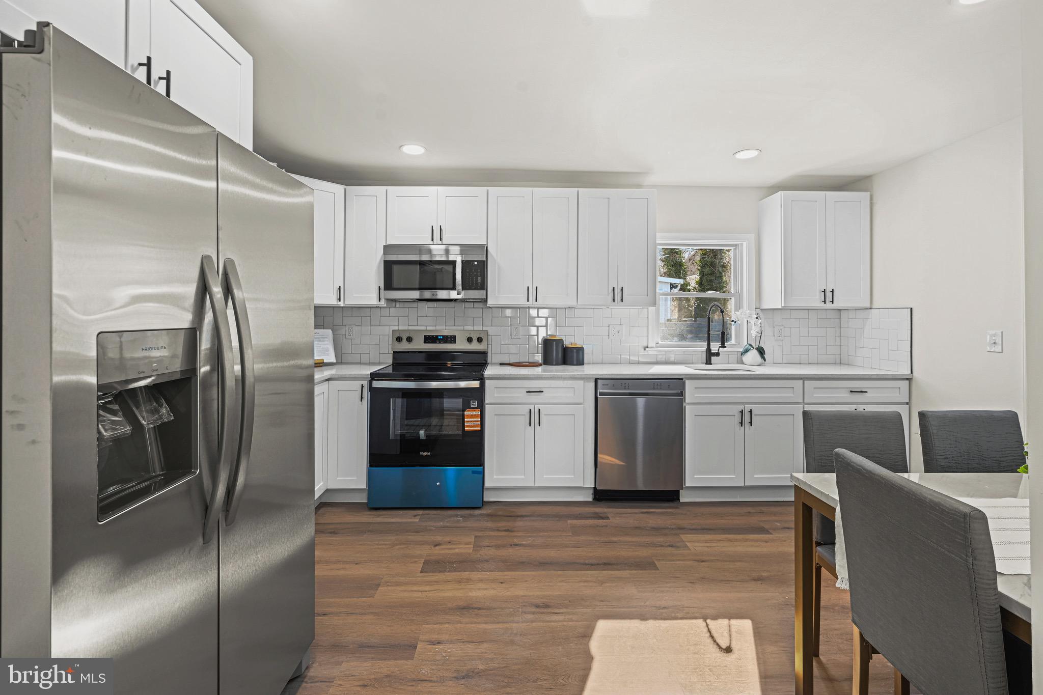 3718 4th Avenue Edgewater, MD 21037 - Photo 11 of 34 a kitchen with stainless steel appliances a refrigerator sink and microwave