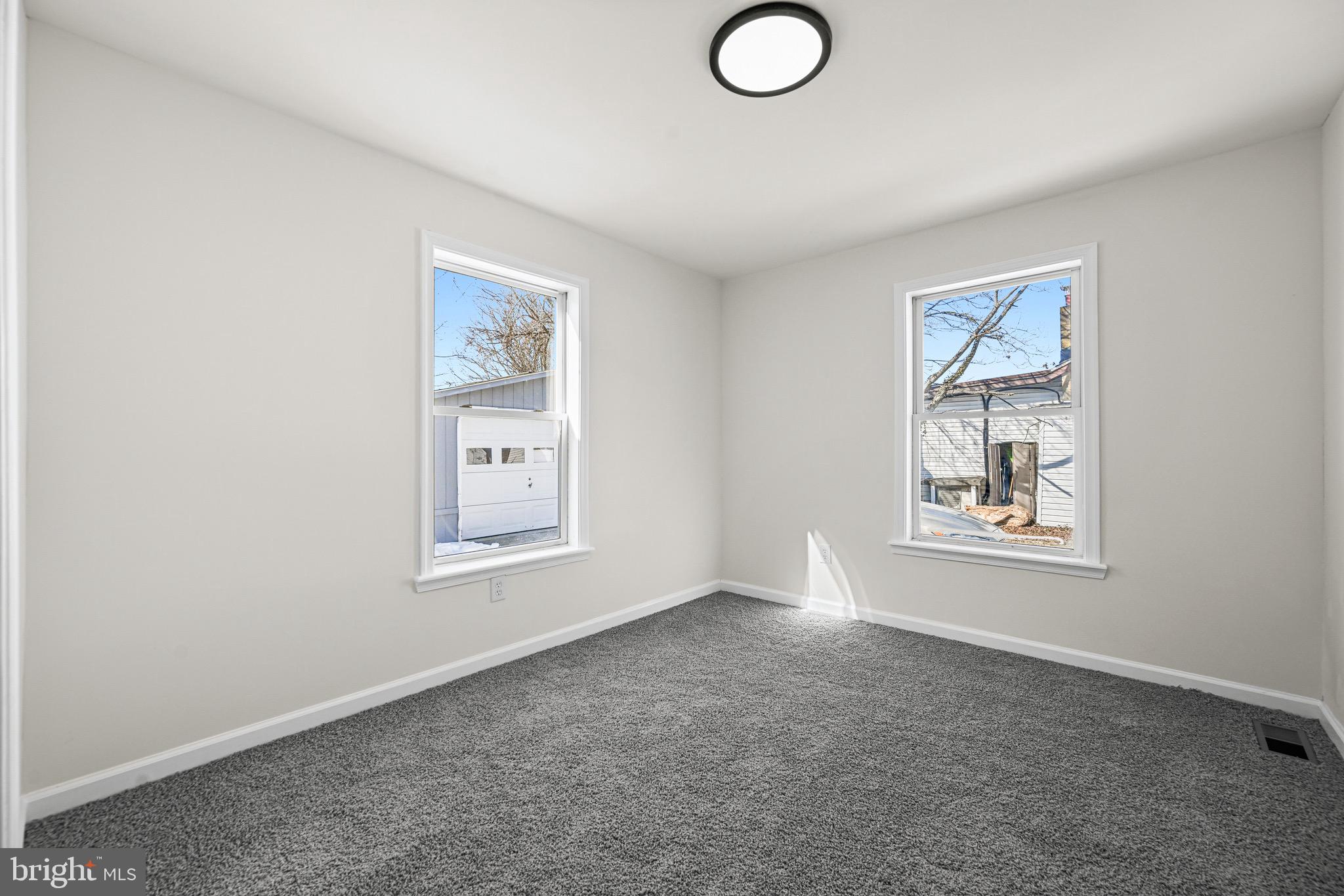 3718 4th Avenue Edgewater, MD 21037 - Photo 18 of 34 an empty room with windows and closet