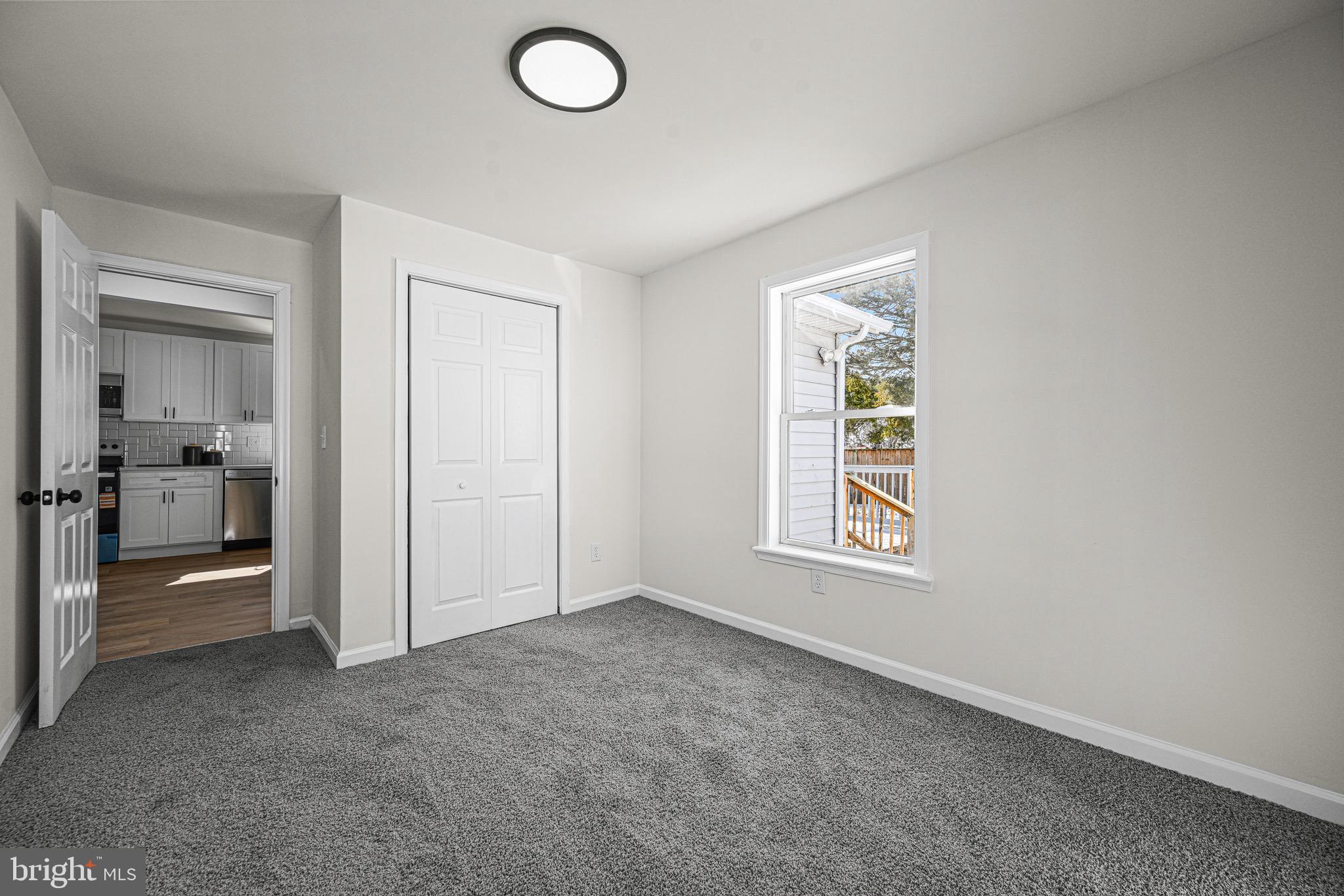 3718 4th Avenue Edgewater, MD 21037 - Photo 19 of 34 an empty room with windows and closet