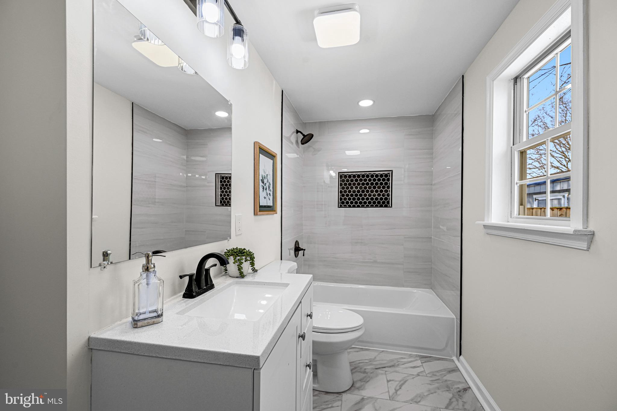 3718 4th Avenue Edgewater, MD 21037 - Photo 20 of 34 a bathroom with a sink a toilet and shower