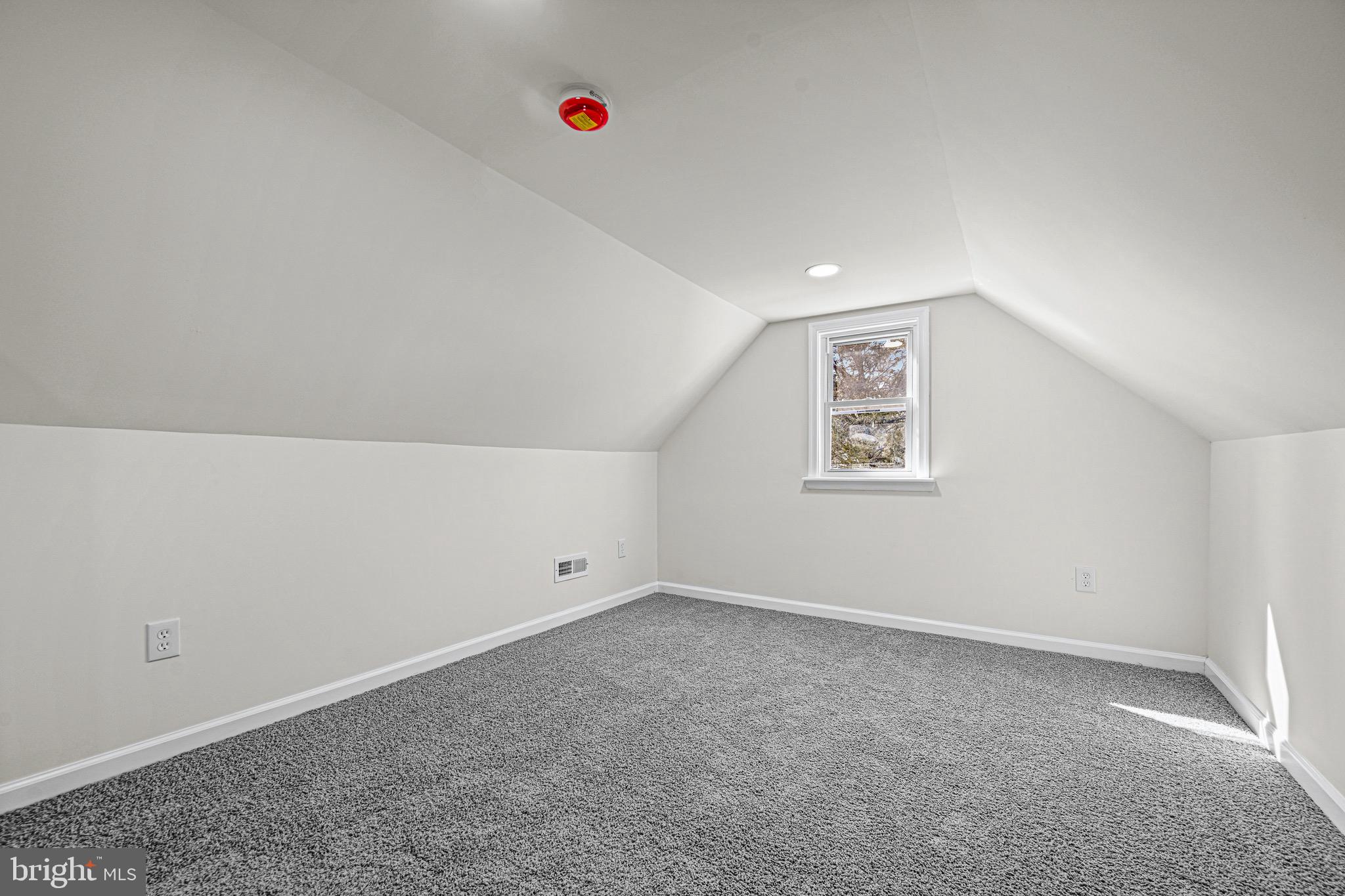 3718 4th Avenue Edgewater, MD 21037 - Photo 22 of 34 an empty room with a projector and hallway