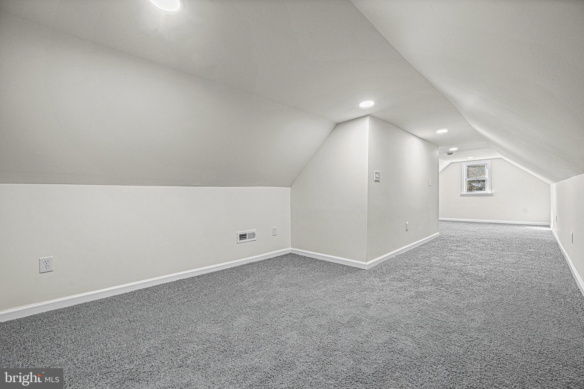 3718 4th Avenue Edgewater, MD 21037 - Photo 25 of 34 an empty room with windows and entrance to other room