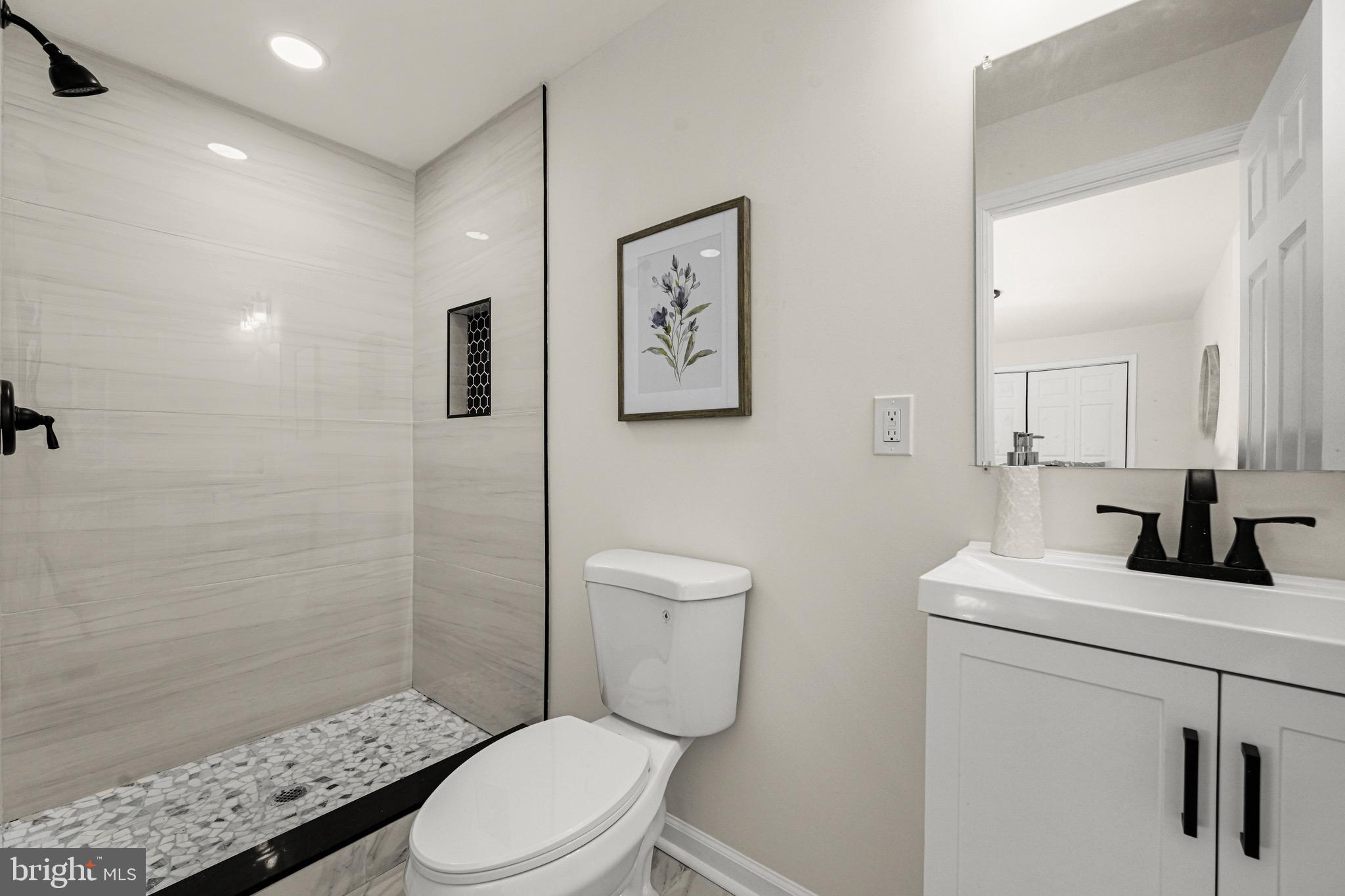 3718 4th Avenue Edgewater, MD 21037 - Photo 26 of 34 a bathroom with a toilet sink and shower