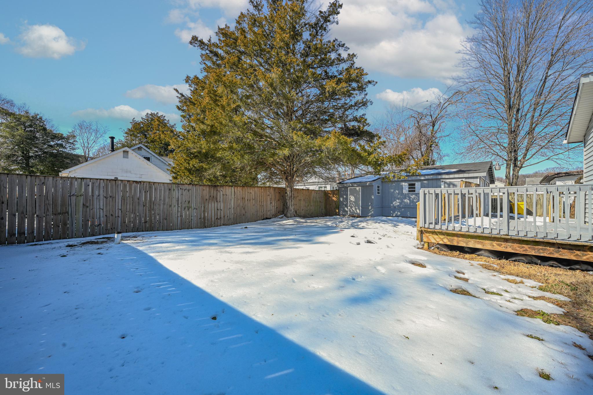 3718 4th Avenue Edgewater, MD 21037 - Photo 30 of 34 a view of a backyard with wooden fence