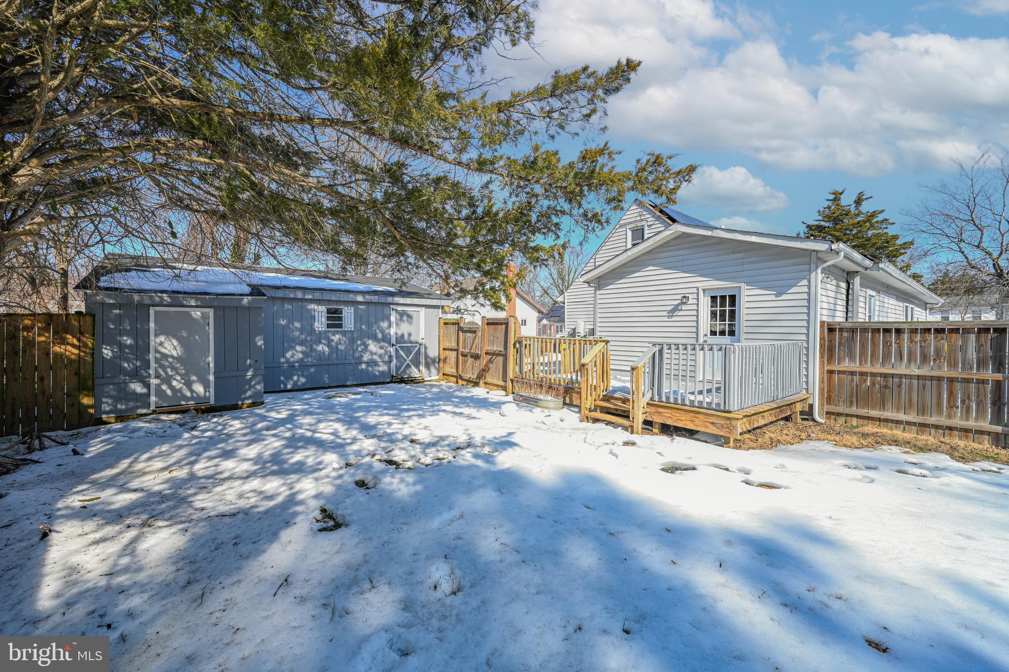 3718 4th Avenue Edgewater, MD 21037 - Photo 31 of 34 a view of a house with a snow in the yard
