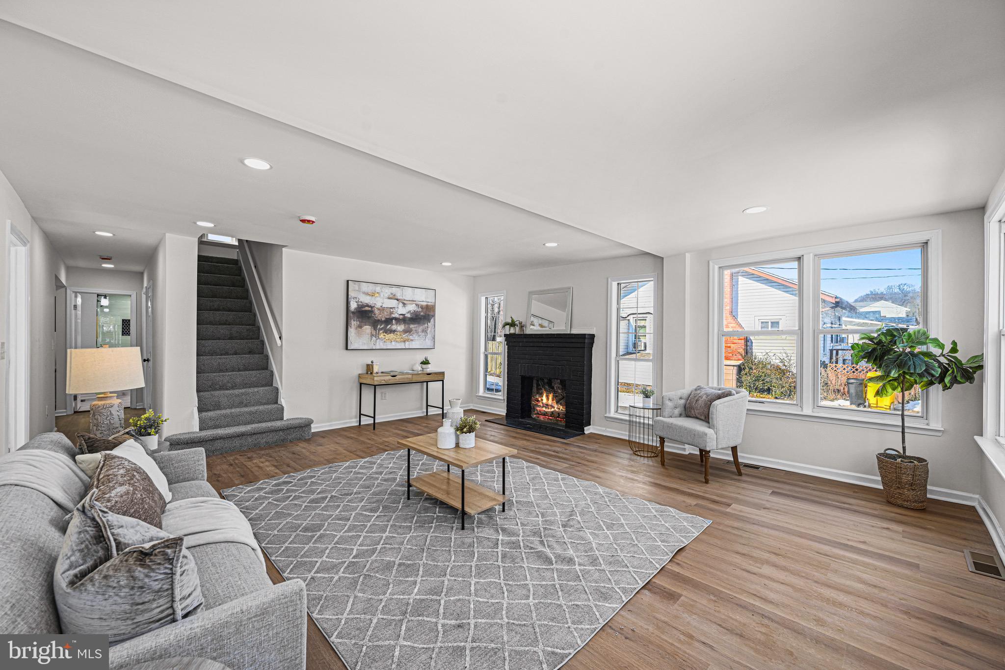 3718 4th Avenue Edgewater, MD 21037 - Photo 4 of 34 a living room with furniture and a fireplace