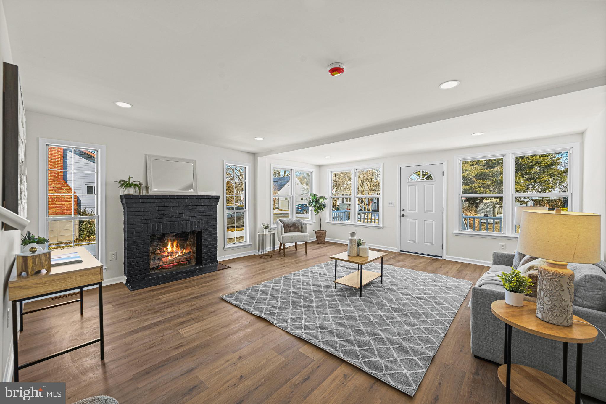 3718 4th Avenue Edgewater, MD 21037 - Photo 6 of 34 a living room with furniture and a fireplace