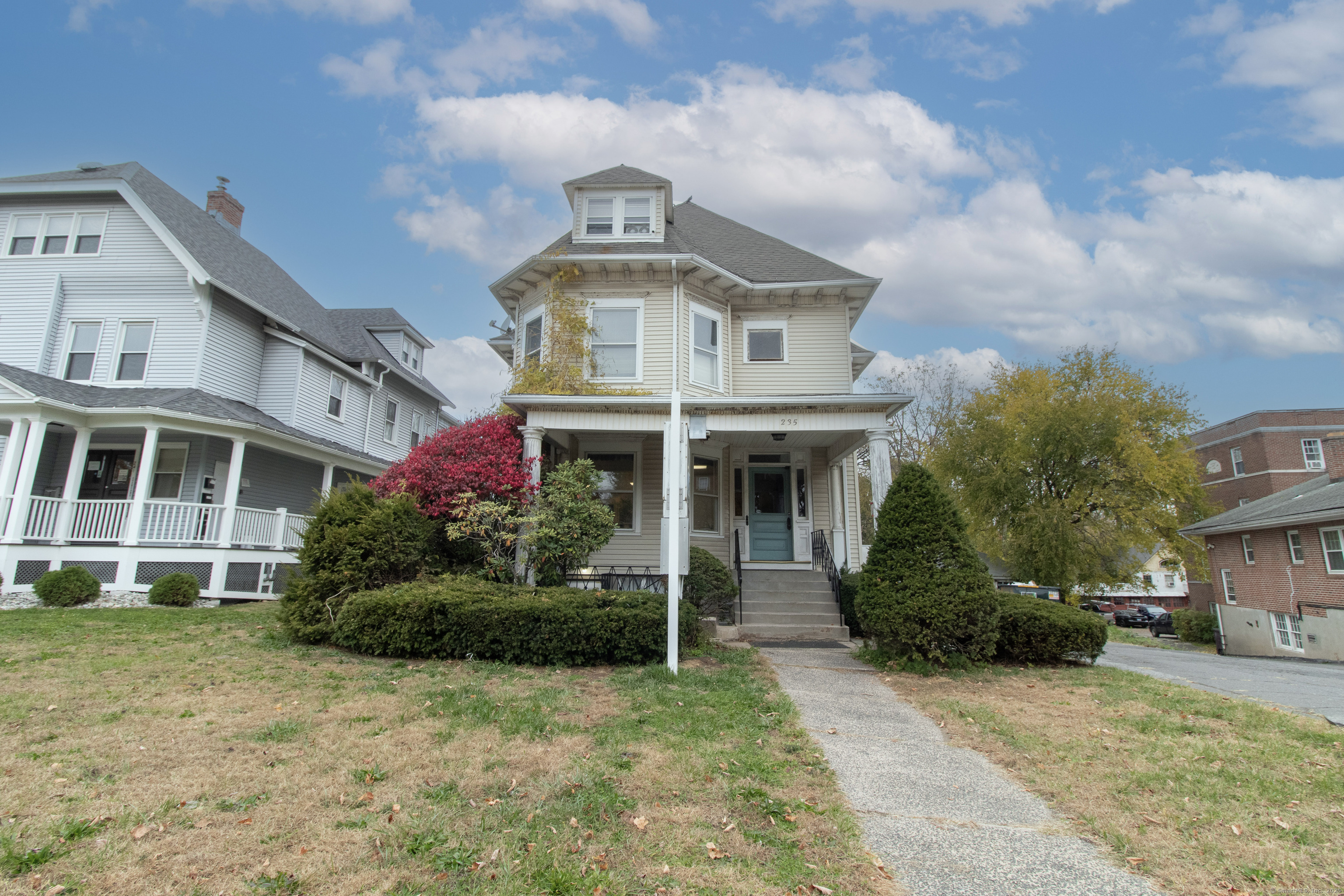 a front view of a house with garden