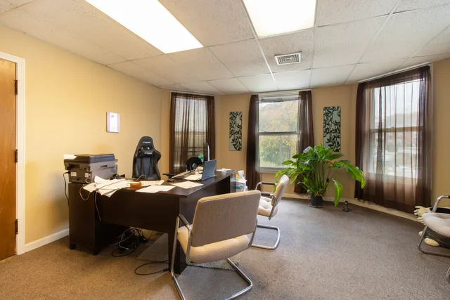 a view of a dining room with furniture window and outside view