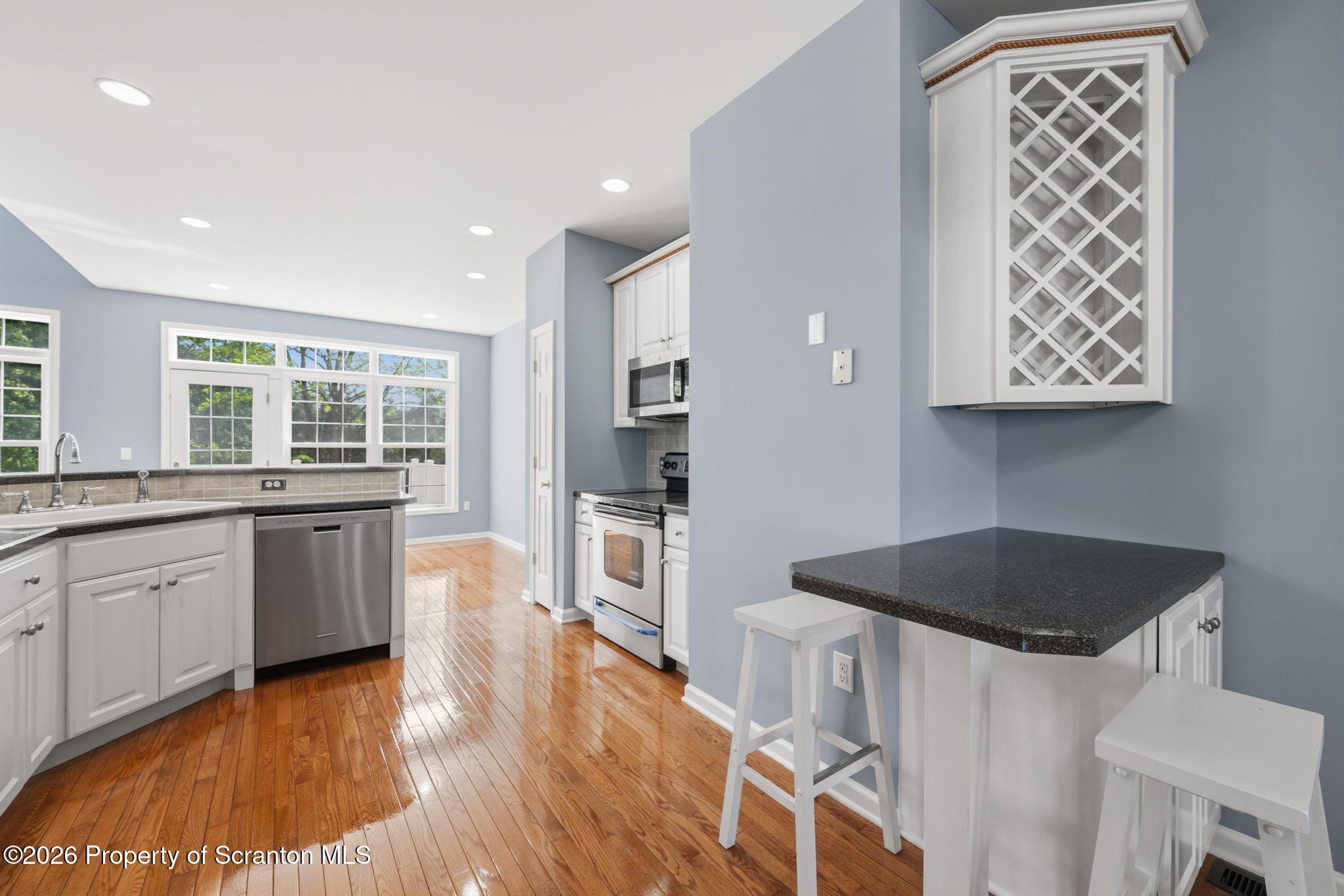 1502 Verne Cl Moosic, PA 18507 - Photo 13 of 46 a kitchen with stainless steel appliances granite countertop a stove and a sink