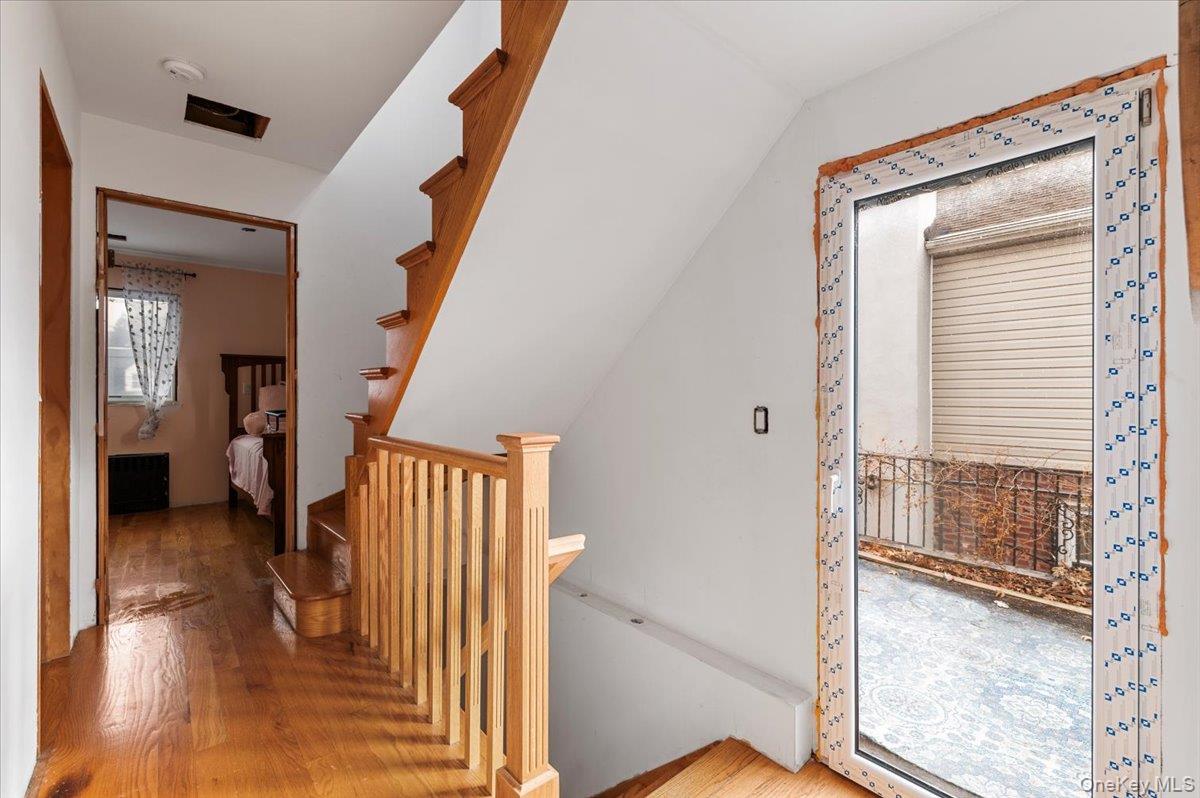 82-06 166th Street Queens, NY 11432 - Photo 12 of 25 Corridor featuring wood finished floors
