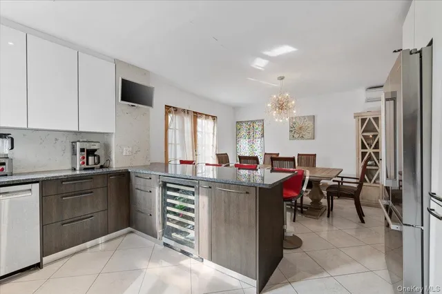 a kitchen with cabinets and window