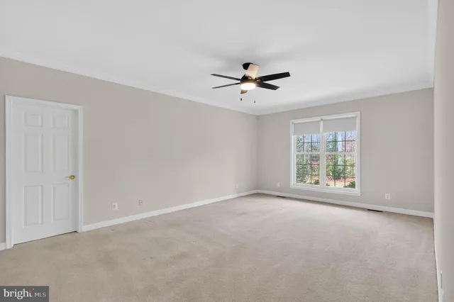 a spacious bathroom with a granite countertop tub a double vanity sink a mirror and a shower