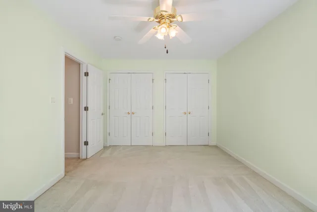 a view of empty room with windows
