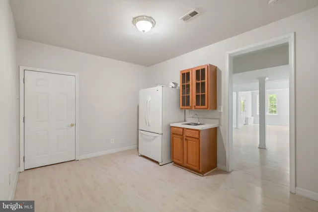 view of a house with a yard and sitting area