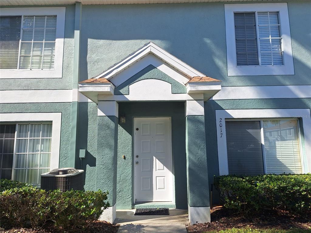 2017 Fluorshire Drive Brandon, FL 33511 - Photo 2 of 9 a view of a house with a potted plant and garage