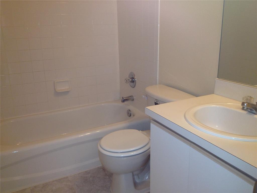 2017 Fluorshire Drive Brandon, FL 33511 - Photo 8 of 9 a bathroom with a sink a toilet and shower