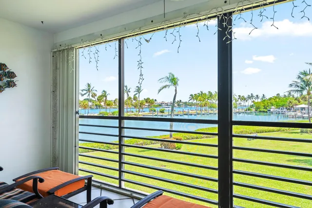 a view of a balcony with chairs