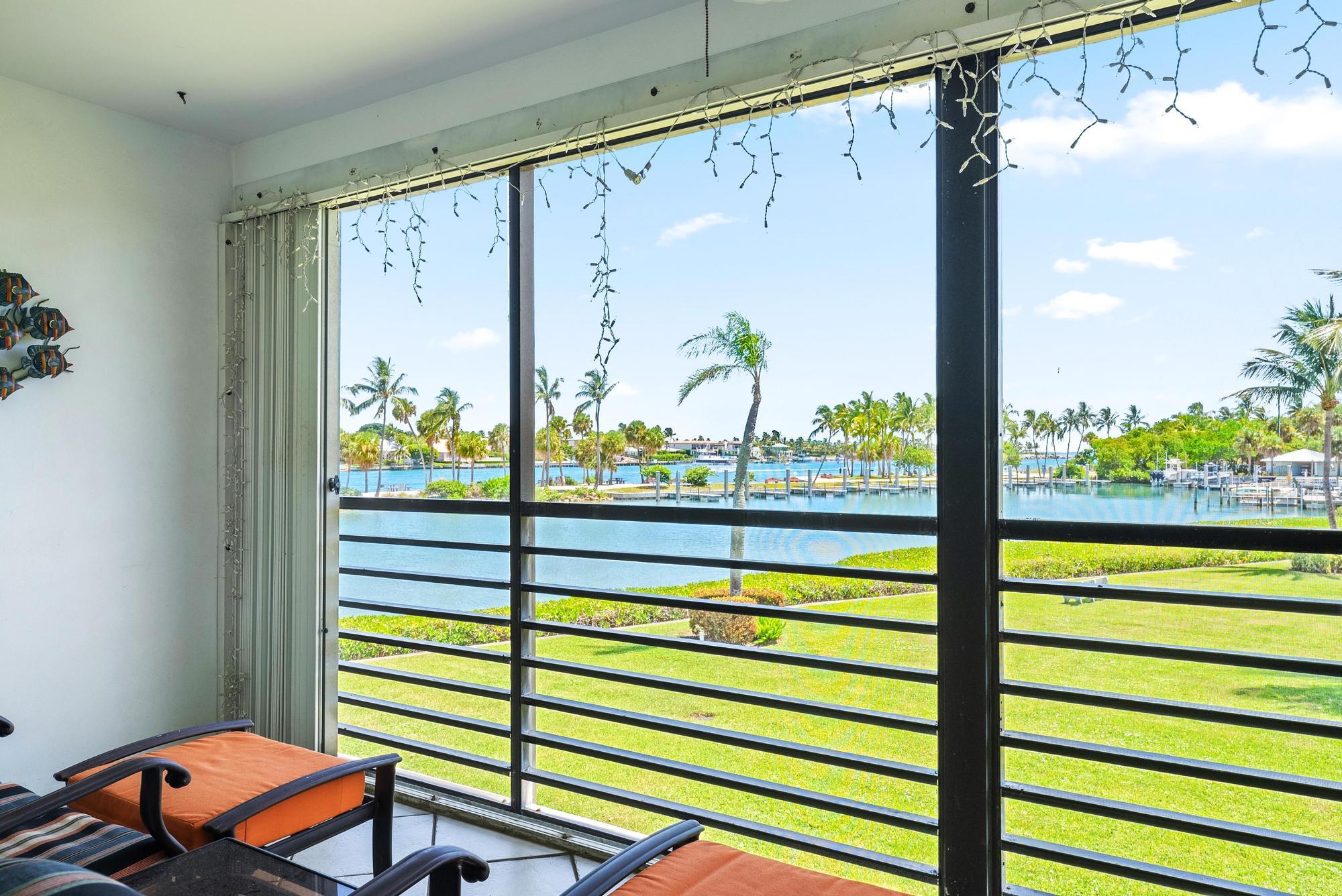 755 Saturn Street, Unit D205 Jupiter, FL 33477 - Photo 15 of 22 a view of a balcony with chairs