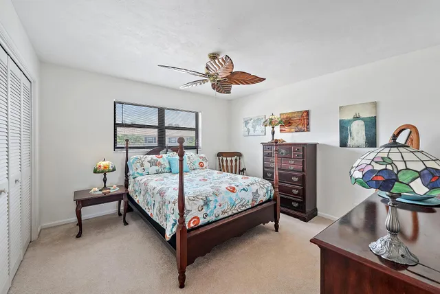 a bedroom with bed and window