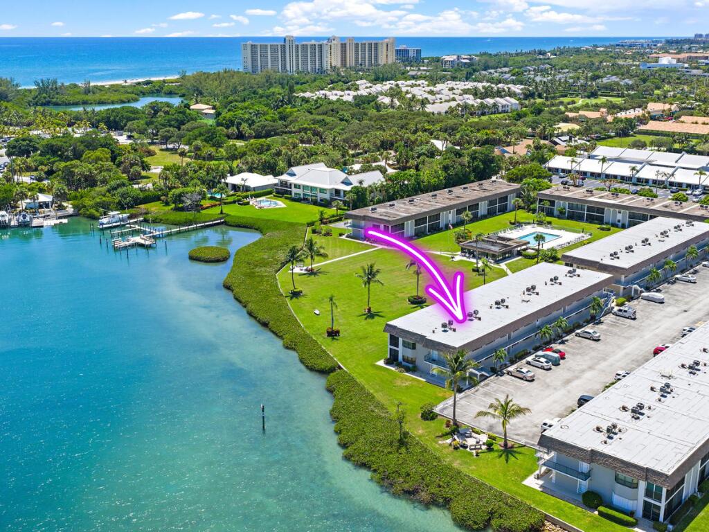 755 Saturn Street, Unit D205 Jupiter, FL 33477 - Photo 3 of 22 an aerial view of a houses with a swimming pool