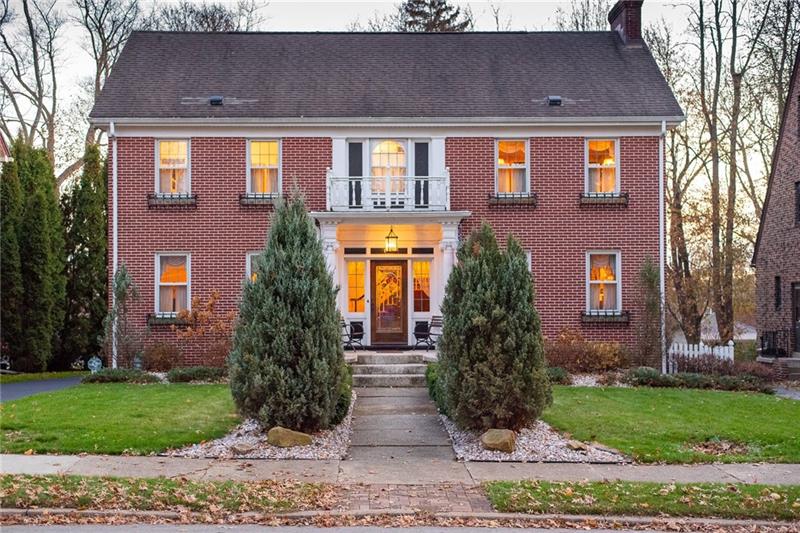 SOLID BRICK HOME HAS TREMENDOUS CURB APPEAL AND STUNNING INTERIOR FEATURES.