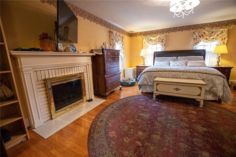 1058 Highland Road Sharon, PA 16146 - Photo 13 of 25 MASTER BEDROOM WITH FIREPLACE