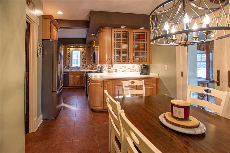 KITCHEN HAS RECESSED AND UNDER CABINET LIGHTING, NEWER BACK SPLASH, LIGHTING AND SS APPLIANCES.